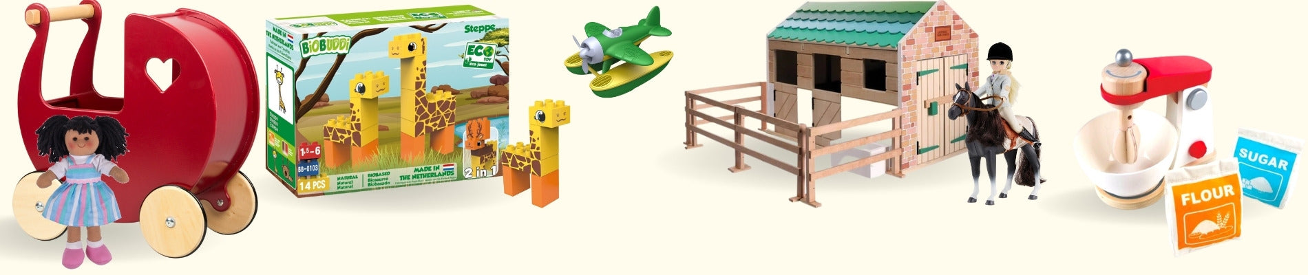 A selection of children's toys including (from l-r) a red pram and doll, giraffe building bricks, play stabels and horse and a wooden toy kitchen mixer.