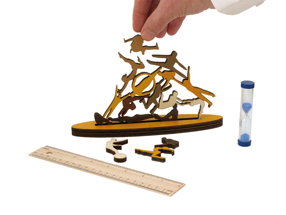 Wooden stacking game with pieces shaped like acrobats.