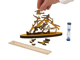 Wooden stacking game with pieces shaped like acrobats.