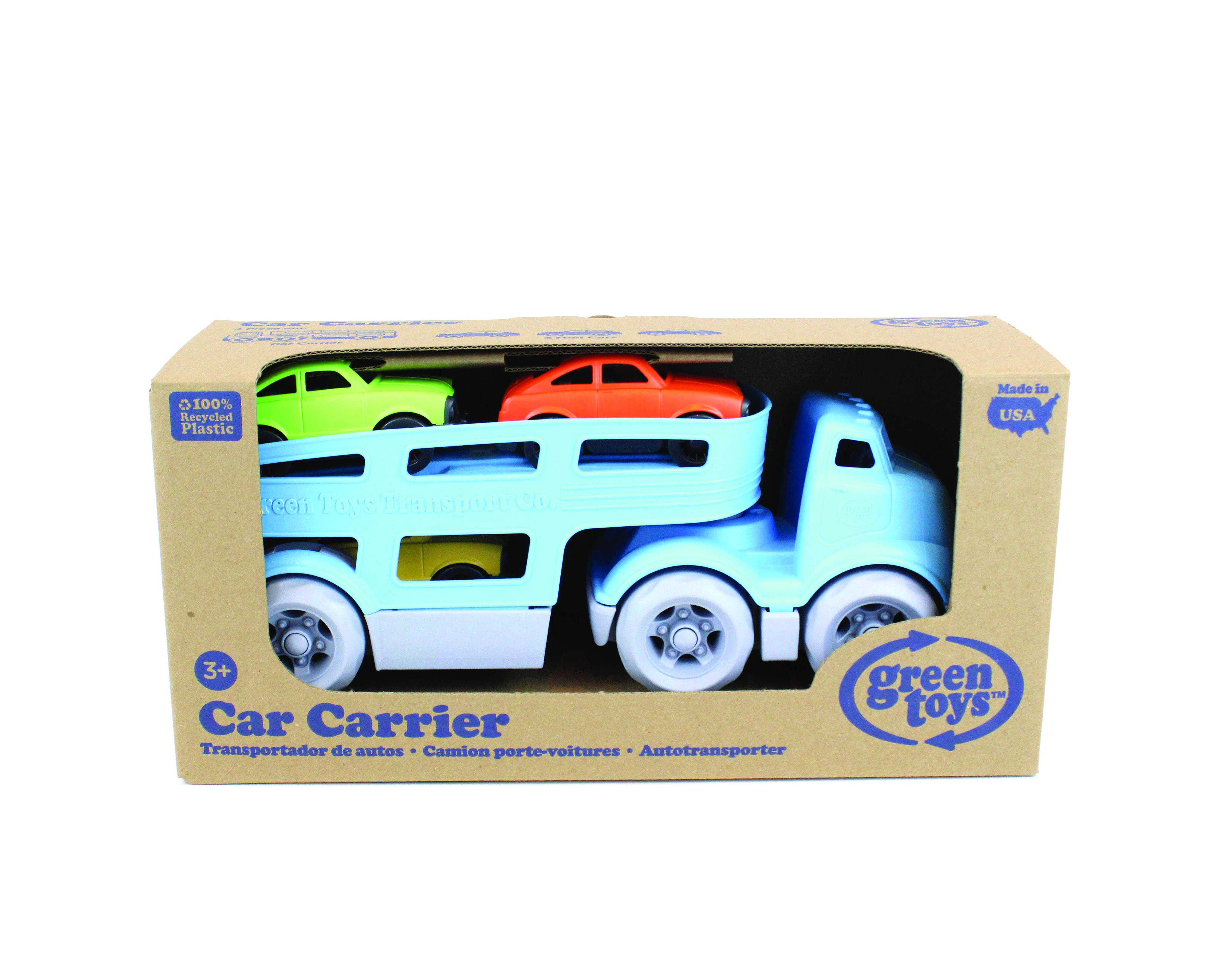 Cardboard packaging holding car transporter toy.