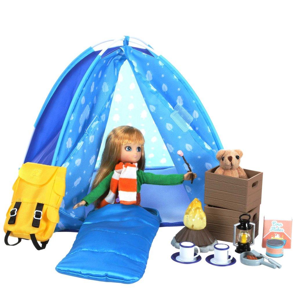 Lottie tent with teddy, sleeping bag, lantern and other camping accessories.