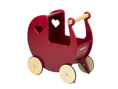 Red wooden pram with light coloured wheels on light background.