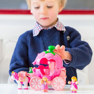 Child playing with carriage and doll.