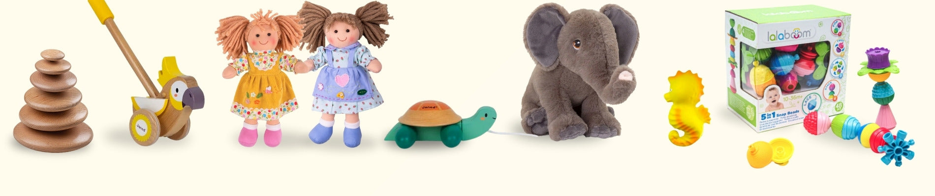 A selection of toys suitable for babies including(l-r) stacking wooden pebble, rag dolls, cuddly elephant and plastic shapes.