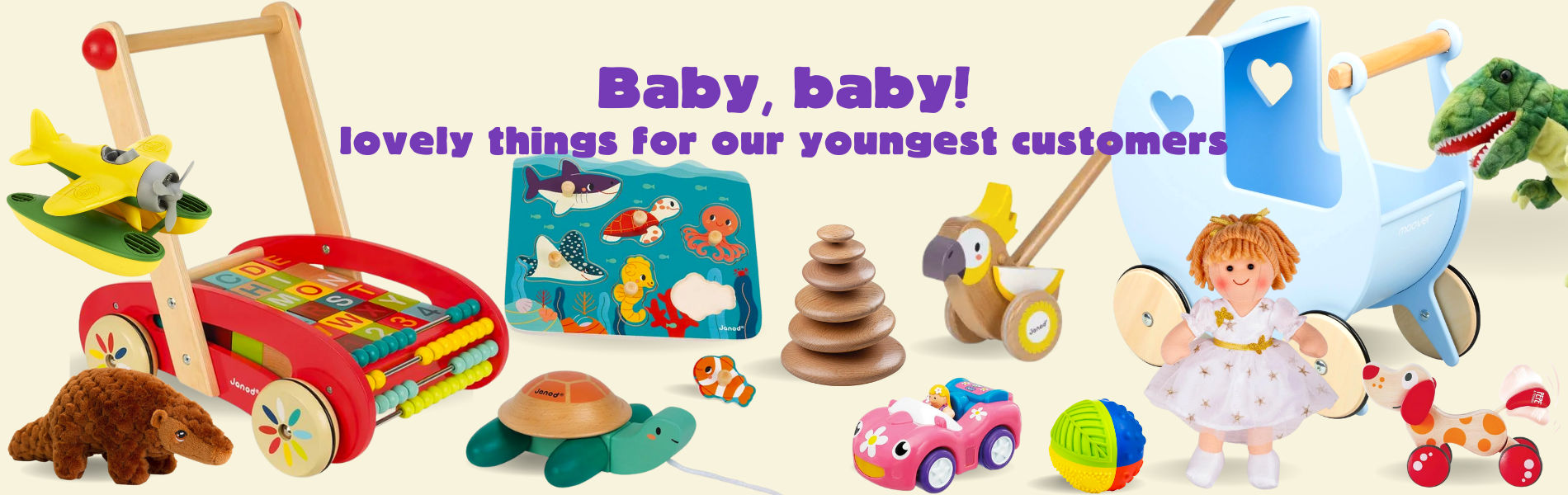 Lots of toys suitable for babies including (from l-r) a red trolley with blocks, a green pull-along turtle, a pink car, a light blue pram and a cuddly green dinosaur.