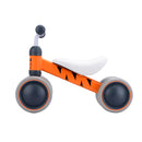 The Boldcube Baby Balance Bike - Benny Tiger features an orange and gray design with black tiger stripes, a white seat, simple handlebars, and two sturdy wheels. It's a perfect jungle-themed first birthday gift for little adventurers.