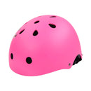 The BOLDCUBE Kids Helmet, shown in bright pink and a side view, features multiple ventilation holes. Made from impact-resistant materials with a smooth matte finish, it includes an adjustable black strap beneath it.