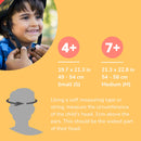 A child happily wears a BOLDCUBE Kids Helmet, aided by an adult. The image displays sizing: 4+ (Small, 19.7-21.3 in) and 7+ (Medium, 21.3-22.8 in), with head measurement tips for safety using impact-resistant materials.