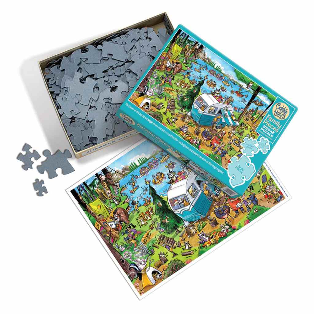 The Cobble Hill "Call of the Wild" 350-piece Family jigsaw puzzle showcases a lively outdoor camping scene with people, a camper van, and playful animals by a lakeside surrounded by trees, with scattered pieces promising fun. The completed image is featured on the box lid.