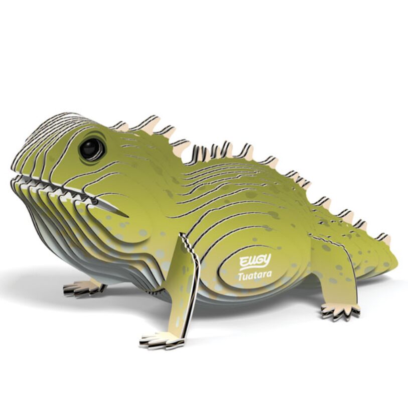 The EUGY Tuatara is a sustainable and collectible 3D cardboard model, featuring a layered green body and distinctive textures. Its design incorporates detailed eyes and scales, with "Tuatara" labeled on the side, all set against a white background.