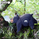 The EUGY Black Bear 3D puzzle, made with eco-friendly inks, features the "Eugy" logo and product name on its side. Standing on a mossy branch with a translucent bubble, it’s perfect as educational décor among green foliage.