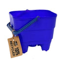 The Crazy Coast Eco 100% Recycled Castle Bucket, in blue plastic with a gray handle and brown "100% Recycled" tag, is ideal for children's outdoor play. Made from eco-friendly materials, it's displayed on a white background.