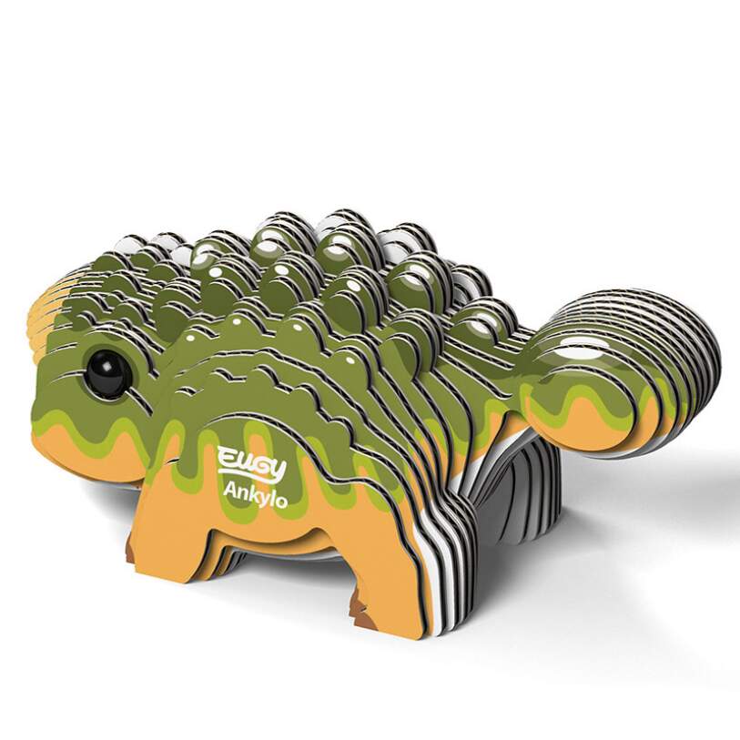 The EUGY Ankylo is a small, vibrant 3D puzzle made from biodegradable card that resembles a green and tan ankylosaurus with a segmented, layered design. The word "Ankylo" is displayed on its side. This collectible from the EUGY brand features a cartoonish look and a friendly expression.