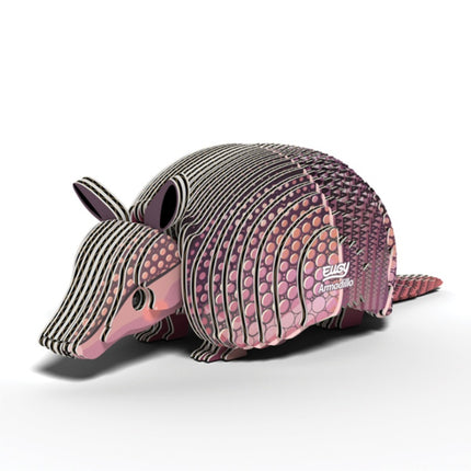 Introducing the EUGY Armadillo, a stunning 3D paper sculpture crafted from sustainable materials featuring pink and gray hues. This design intricately replicates the textures of an armadillo's shell and is assembled using non-toxic glue. The product proudly displays "EUGY Armadillo" on its side, showcasing a perfect blend of creativity and eco-friendliness.