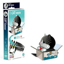 Introducing the "Eugy Cat - Tuxedo" by EUGY, a cardboard model kit that creates an eco-friendly 3D figure of a cat in a tuxedo pattern sitting inside a box. The packaging highlights the completed model along with various items adorning the box's surface, making it an ideal choice for fans of collectible miniature figures.