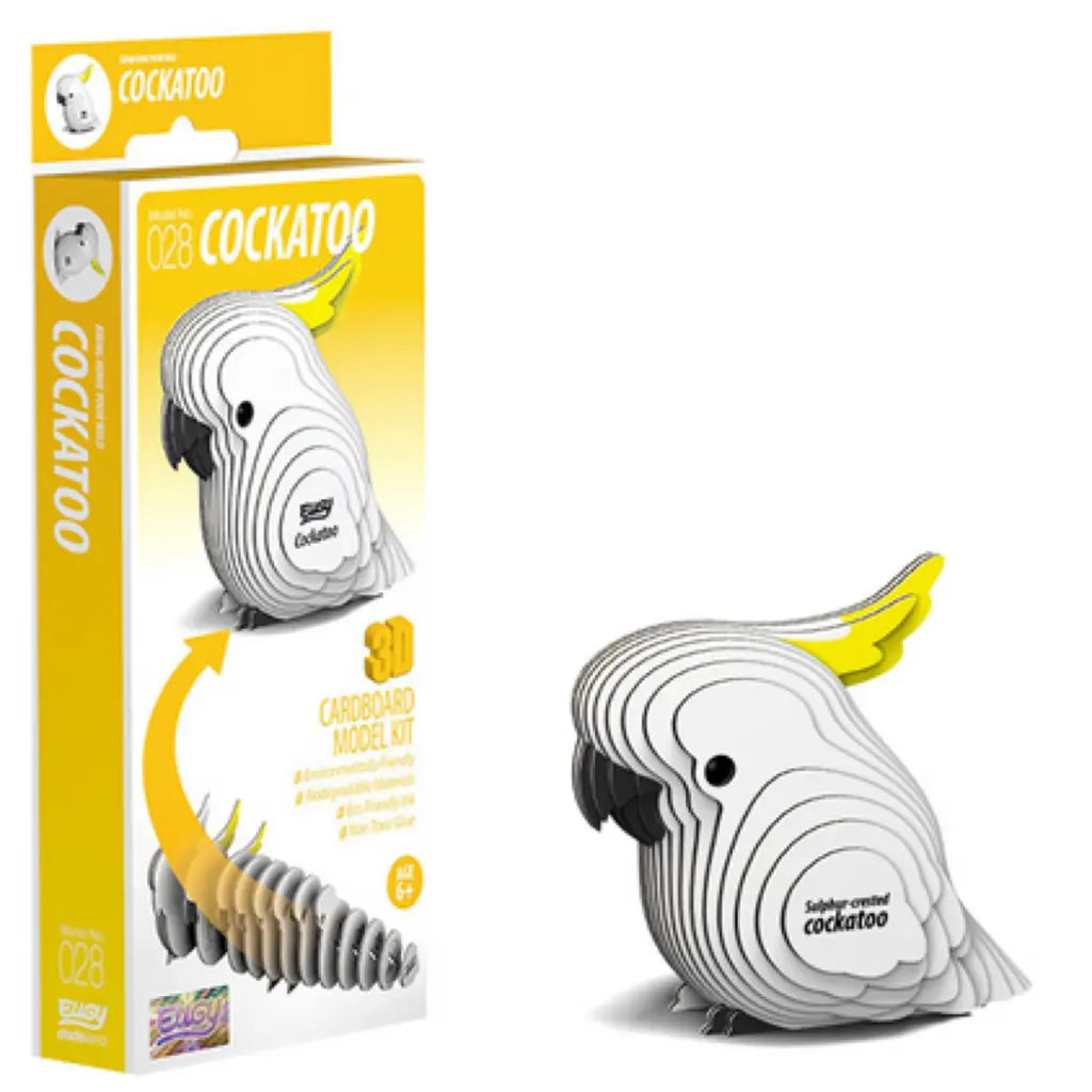 The EUGY Cockatoo kit is a 3D cardboard puzzle model, shown in eco-friendly packaging featuring an assembled bird with white and yellow parts. It reads "028 Cockatoo," signifying it's easy to assemble and ideal for ages 6 and up.