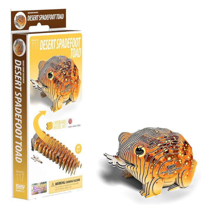 Explore the EUGY Desert Spadefoot Toad 3D puzzle model kit, showcasing a vividly-colored cardboard toad with striking orange and brown patterns. The eco-friendly packaging includes a detailed illustration and description of this intriguing creature, offering an engaging glimpse into its unique characteristics.