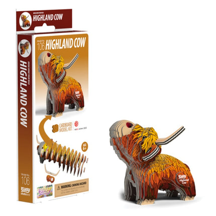 The image features the EUGY Highland Cow cardboard model kit by EUGY, made from eco-friendly and sustainable materials. The box presents an illustrated version of the completed model, showcasing a layered, multicolored design. This kit contains 106 carefully crafted pieces and is suitable for ages 6 and up.