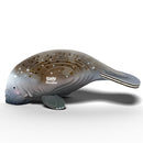The EUGY Manatee by EUGY features a cartoon-like manatee model with constellation patterns on a white background to promote ocean conservation. The design showcases smooth gray contours and the word "Manatee" near the pattern.
