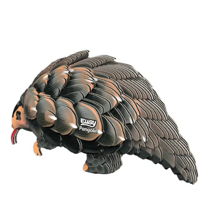 A stylized sculpture of a pangolin, an endangered animal, crafted with environmentally-friendly layered pieces in shades of brown and black. The curled pangolin features a visible pink tongue and proudly displays the brand name "EUGY" on its side.