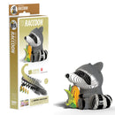 The EUGY Raccoon model kit, featuring an eco-friendly cardboard raccoon next to a corn cob, is presented beautifully. The packaging to the left provides assembly instructions and highlights the 3D collectible raccoon model. Ideal for children aged 6 and up, this kit from EUGY guarantees hours of imaginative fun.