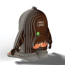 The EUGY Sasquatch Big Foot by EUGY is a 3D model of a stylized, striped figurine featuring a rounded head and minimal facial features without visible arms. Made from sustainable materials, it includes a label stating "Designed in New Zealand" and is enhanced with a small clover accessory.