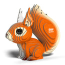 A stylized, layered model of an orange and cream red squirrel with a large bushy tail, featuring the words "EUGY Squirrel" on its side, rests on a white surface. This eco-friendly design from EUGY combines intricate lines with a 3D effect.