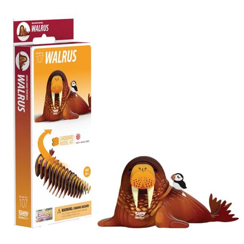 This EUGY Walrus 3D craft collectible includes a biodegradable card model kit featuring a walrus with a small bird on its back. The packaging showcases the assembled model and its parts, making it suitable for ages 6 and up. It comes with an environmentally-friendly warning label as part of EUGY's commitment to sustainability.