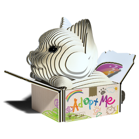 The EUGY Eugy Cat - Mocha, an environmentally-friendly cardboard cat-shaped sculpture, is showcased inside an open box. The packaging is adorned with colorful illustrations, including the words "Adopt Me" alongside drawings of a rainbow, flowers, and paw prints, highlighting creative excellence.