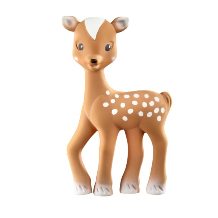 Fanfan the Fawn by Sophie La Giraffe is a natural rubber toy deer with a light brown body, white spots, and hooves. Its friendly face and light forehead patch invite play. Ideal for teething and sensory play, Fanfan stands against a plain white background.