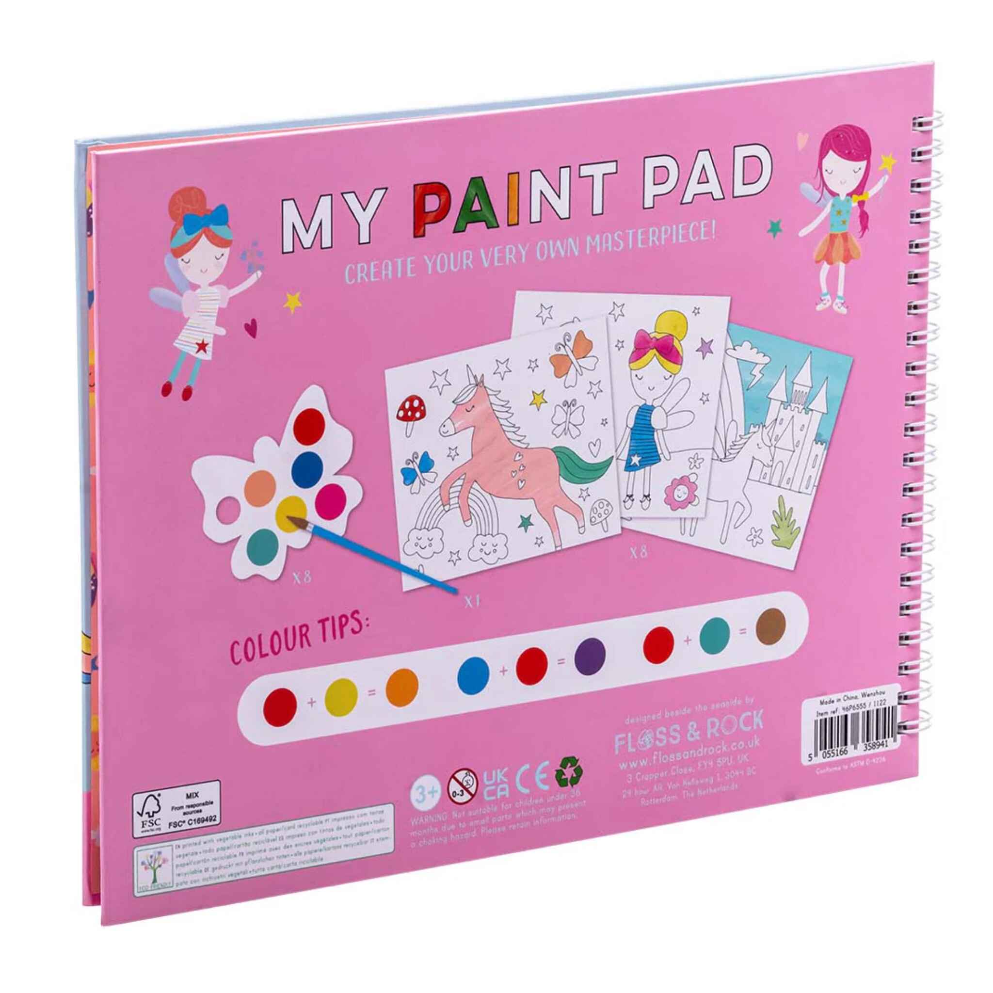 The eco-friendly pink spiral-bound painting pad, called "Rainbow Fairy My Painting Pad" by Floss & Rock, features colorful illustrations of a unicorn, castle, and fairy. It includes butterfly-shaped palettes with paint droplets and showcases a range of color tips displayed below the whimsical scenes.