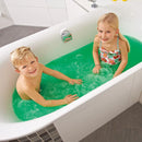 Two children are sitting in a bathtub filled with Zimpli Kids' Gelli Baff. The boy is on the left, and the girl on the right wears a colorful swimsuit. They are smiling and playing happily in the bathroom, which has white tiles and a grey floor.