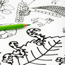 Introducing the eggnogg Giant Poster / Tablecloth – Countryside: a black and white coloring page featuring leaves, a horse, and decorative elements. Perfect for crafts, it's accompanied by a green colored pencil to bring this serene scene to life.