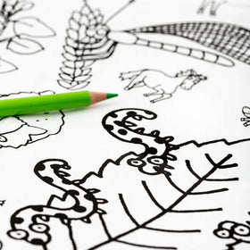 Introducing the eggnogg Giant Poster / Tablecloth – Countryside: a black and white coloring page featuring leaves, a horse, and decorative elements. Perfect for crafts, it's accompanied by a green colored pencil to bring this serene scene to life.