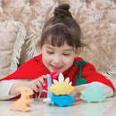 Child playing with colourful dinosaur toys on a couch