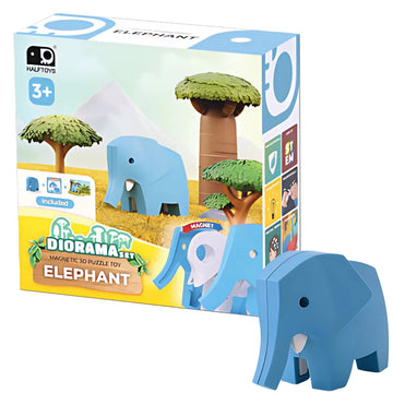 The Halftoys Diorama - Elephant by Halftoys is an interactive animal playset for ages 3+, featuring a blue elephant figure, tree, and illustrated savanna scenery. The toy elephant is shown next to the box.