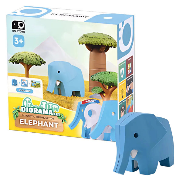 The Halftoys Diorama - Elephant by Halftoys is an interactive animal playset for ages 3+, featuring a blue elephant figure, tree, and illustrated savanna scenery. The toy elephant is shown next to the box.