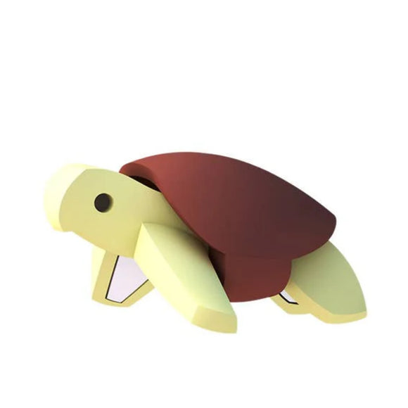 The Halftoys Diorama - Green Turtle by Halftoys features a minimalist, cartoon-style figure with a yellow body and brown shell, ideal for ocean-themed playsets and photographed on a plain white background.