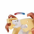 Two stylized plastic animal heads, one brown and one yellow, face each other with a white section in between on the Halftoys Diorama - Lion by Halftoys. An arrow labeled "MAGNET" curves above, showing magnetic attraction—great for animal-themed playsets.