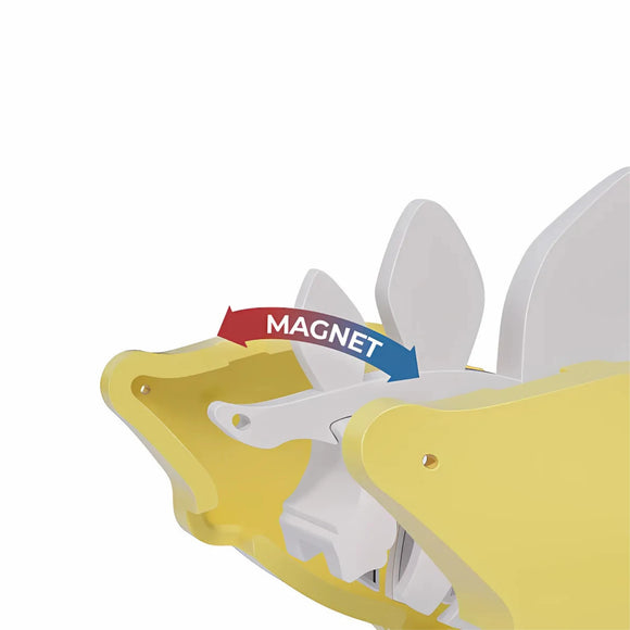 A close-up illustration of the Halftoys Diorama - Stego by Halftoys shows an arrow labeled "MAGNET" pointing to a rotating white fan part inside, making it perfect for STEM playsets or pairing with educational dinosaur toys for hands-on learning.
