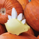The Halftoys Diorama - Stego by Halftoys is a small yellow stegosaurus figure with white spikes, sitting on orange pumpkins—ideal for educational dinosaur toys or STEM playsets.