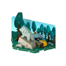 The Halftoys Diorama - Wolf by Halftoys features a 3D paper scene with a wolf on gray rocks among green trees, next to a yellow tent and campfire beneath a blue sky—ideal for woodland-themed play or creative STEM adventures.