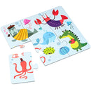 Explore the vibrant "Into the Wild 4-in-1 Jigsaw Puzzle" by Into the Wild, featuring sea creatures like a top hat-wearing sea lion and a playful octopus. Perfect for Wild Pre-school Games fans, it keeps one piece—the octopus—aside to spark curiosity and fun.