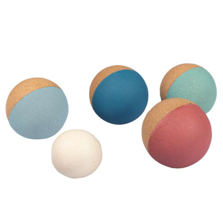 The Champions Cork Boccia Set by Korko includes four cork balls with blue, teal, and red partial coloring, plus a solid white target ball, set against a white background—ideal for enhancing fine motor skills.
