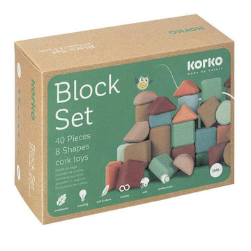 The "Tall Architects, 40 Cork Building Blocks" by Korko box displays colorful cork blocks in diverse shapes and sizes. The packaging highlights include "40 Pieces, 8 Shapes" and promote the set as eco-friendly, durable, and educational for enhancing fine motor skills.