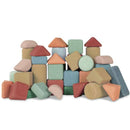 Korko's "Tall Architects, 40 Cork Building Blocks" set features colorful geometric shapes like cylinders, rectangles, triangles, and semi-circles in red, green, orange, blue, and beige—perfect for enhancing fine motor skills through stacking and creative play.