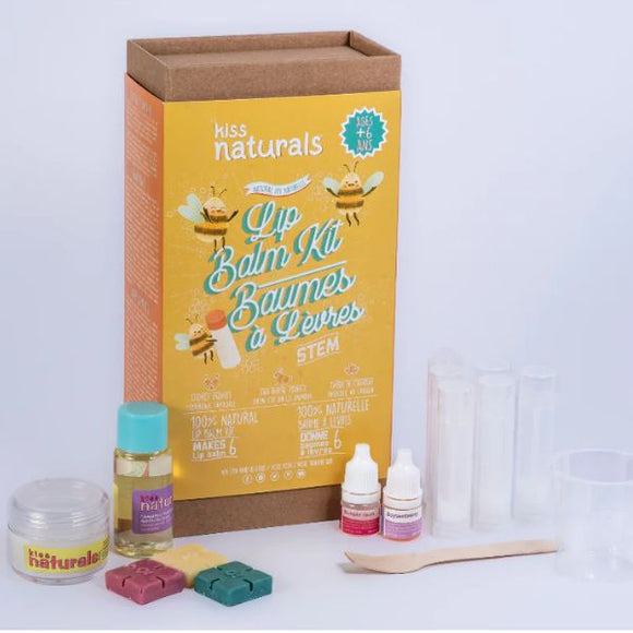 The "DIY Natural DIY Lip Balm Kit" by KISS NATURALS is packaged in a brown box decorated with vibrant graphics and text. This DIY kit includes non-toxic ingredients, containers, a wooden spoon, and step-by-step instructions to help you craft your own lip balm.