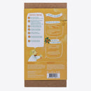 The cardboard packaging of the KISS NATURALS DIY Natural Lip Balm Kit lists its contents and non-toxic ingredients in both English and French. It boasts colorful illustrations, including a cartoon character holding a honey jar, with a bee and honeycomb pattern design element, making it perfect for your DIY project.