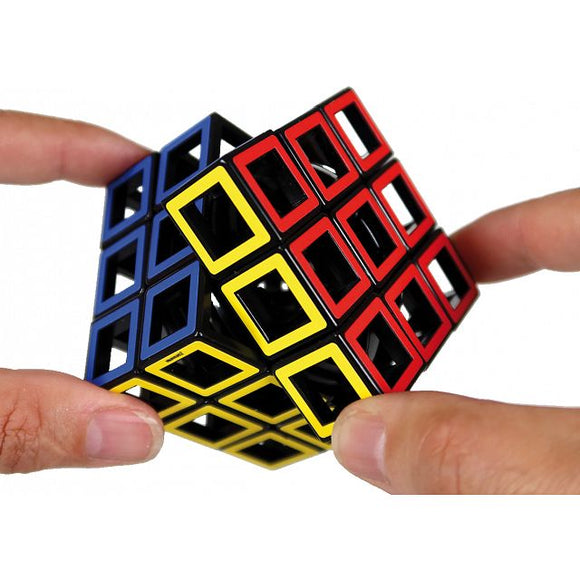 Two hands hold a captivating Meffert - Hollow Cube Puzzle from MEFFERT'S PUZZLES, featuring interconnected open cubes. This design showcases vibrant red, yellow, and blue colors, offering a unique challenge for puzzle enthusiasts.
