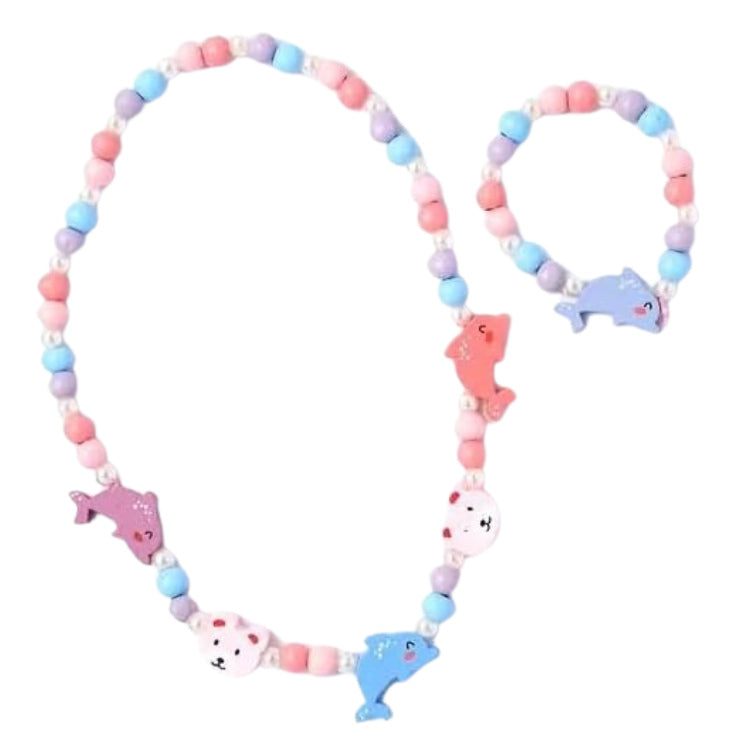 The Dolphin Bead Necklace & Bracelet Set by molly & rose is a colorful children's accessory featuring round pink, blue, purple, and white beads with playful dolphin and fish charms.